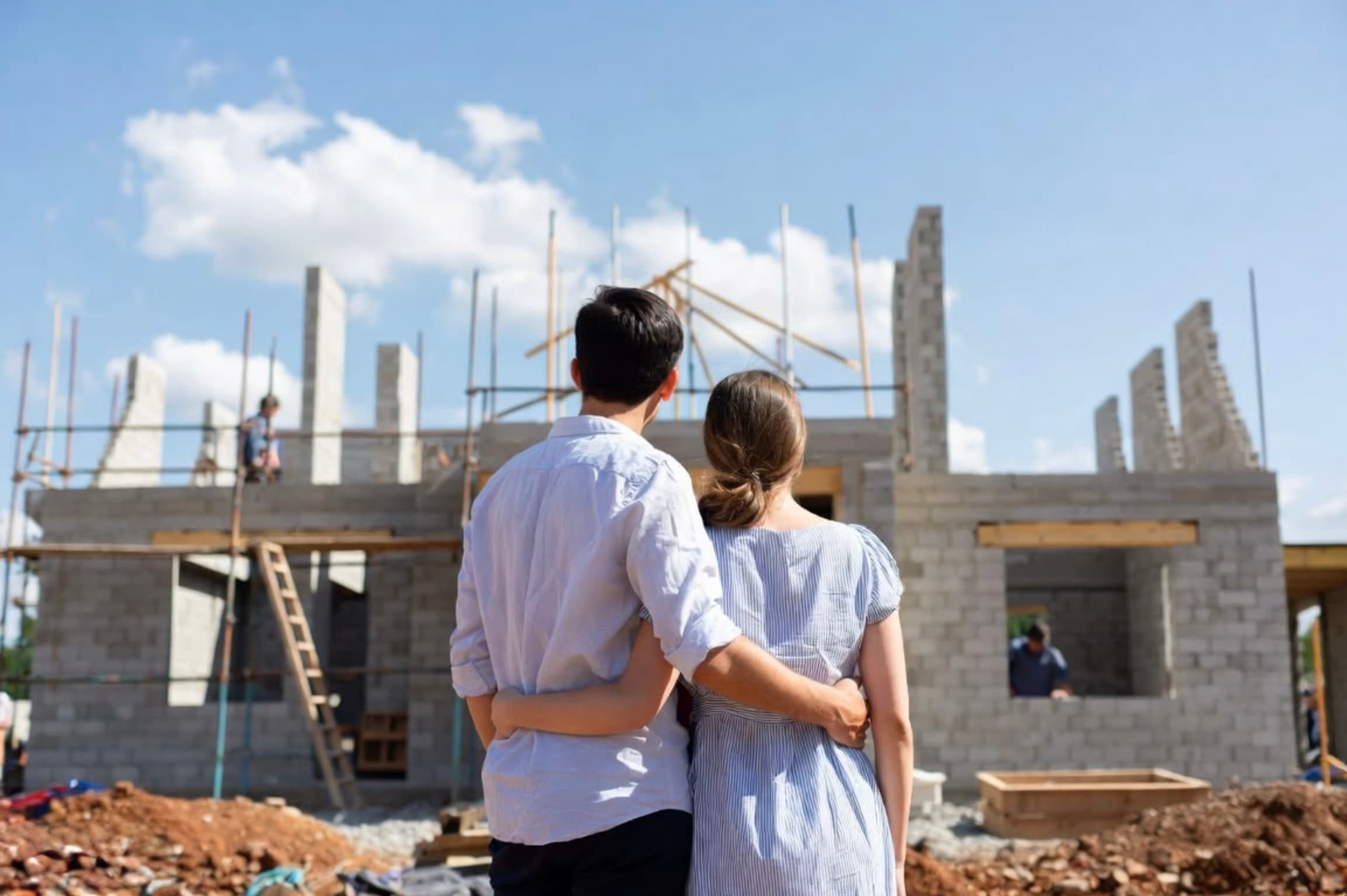 Couple watching the construction of their new home